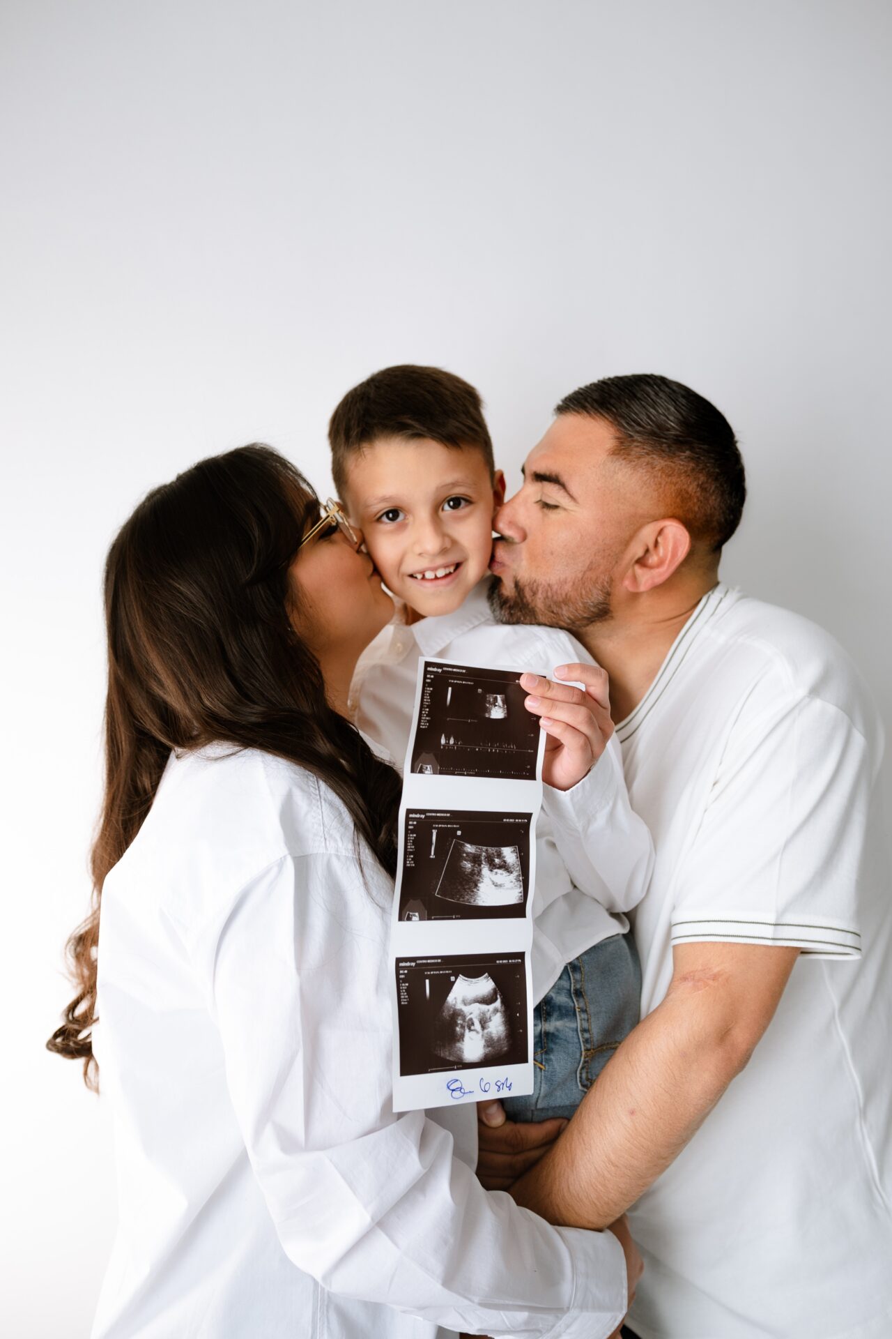 Family expecting another child. Child happy to become a big sibling.