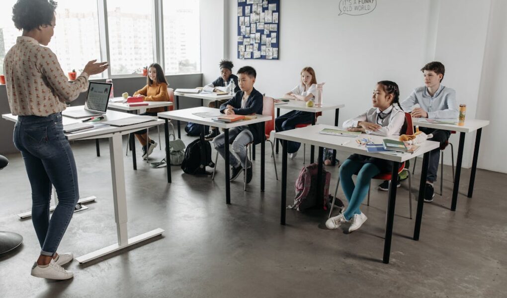 Teacher in classroom with kids.