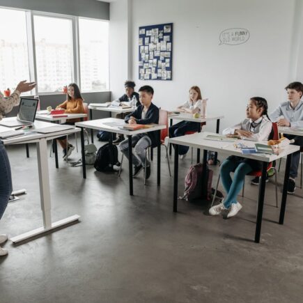 Teacher in classroom with kids.