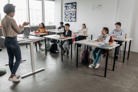 Teacher in classroom with kids.