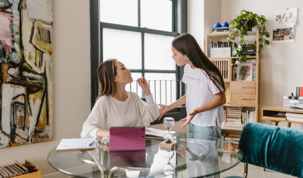 Mother and daughter seemingly having a discussion. Representing a child talking back to their mother.