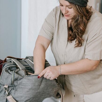 Mom packing diaper bag.