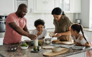 Family spending time together and preparing a meal.