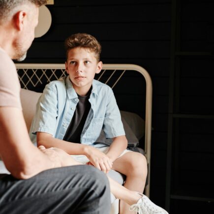 Father having a conversation with his son.