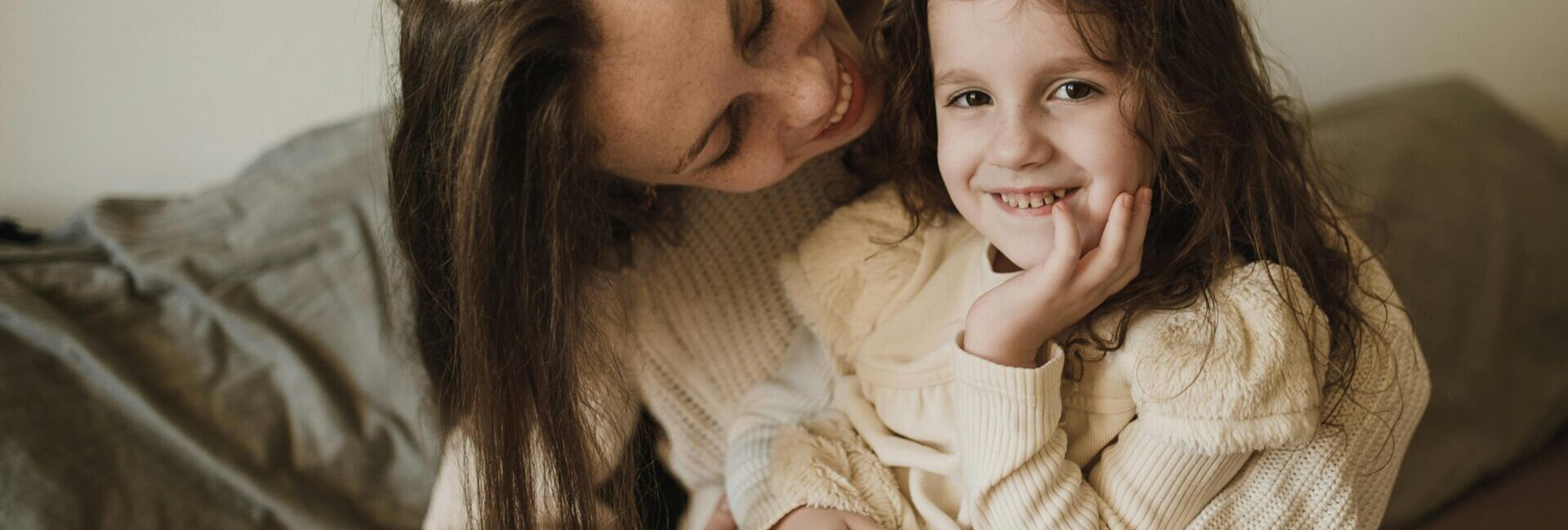 Mom hugging her child.