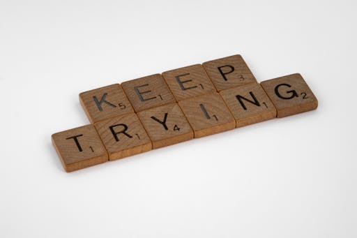 Word tiles spelling Keep trying. Encourage your child not to easily quit.